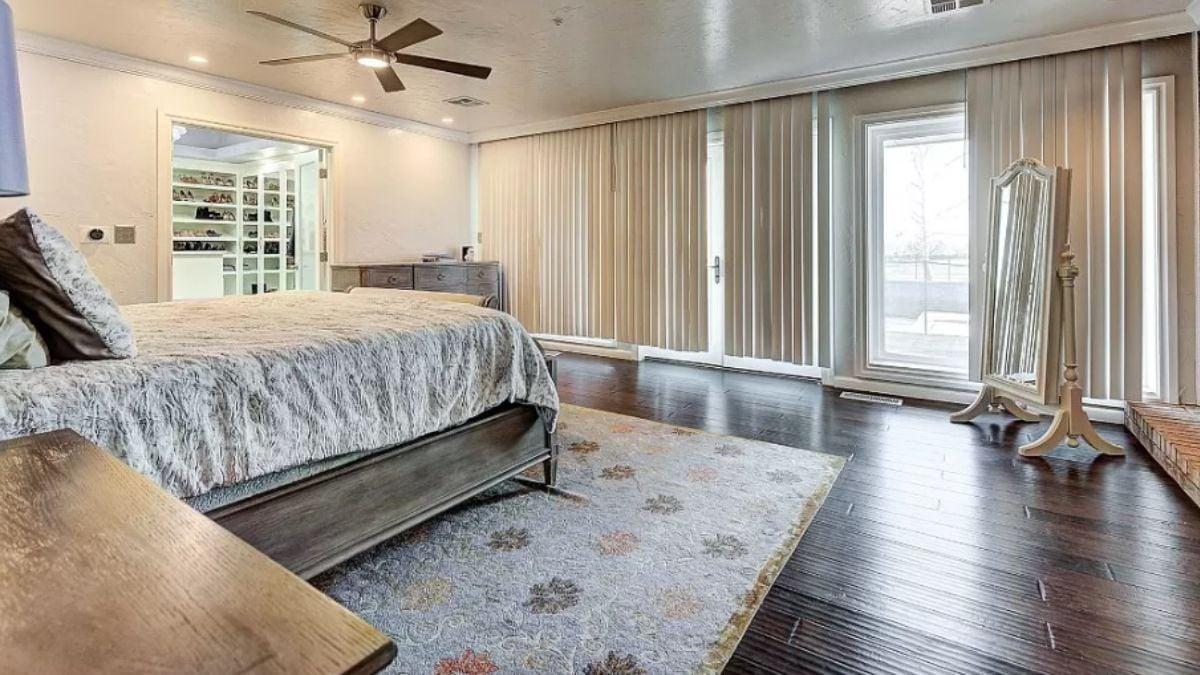 Check Out the Floor-to-Ceiling Windows in This Elegant Master Bedroom