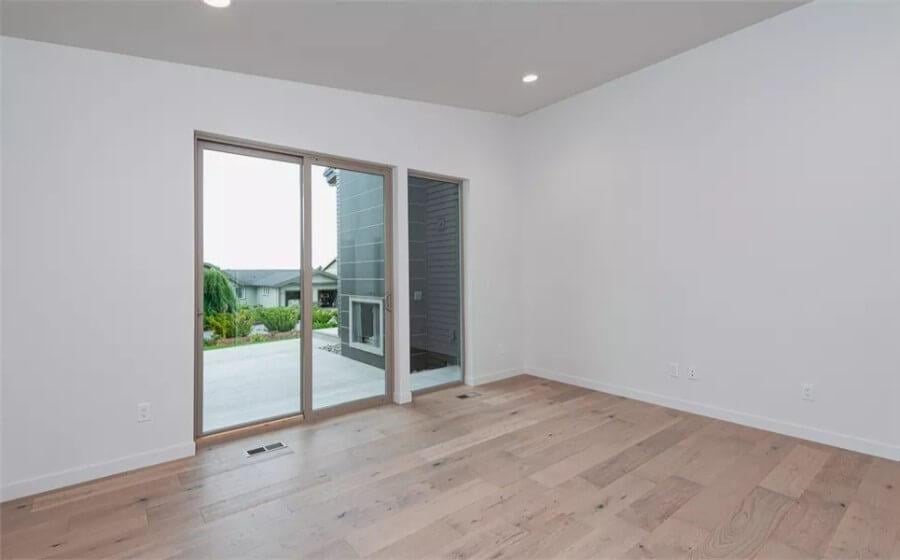 Minimalist Room with Expansive Glass Doors to the Patio