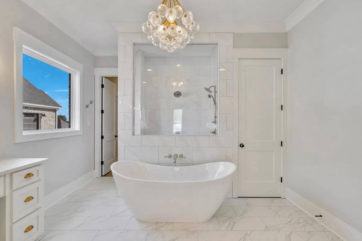 Admire the Freestanding Tub Under This Eye-Catching Chandelier