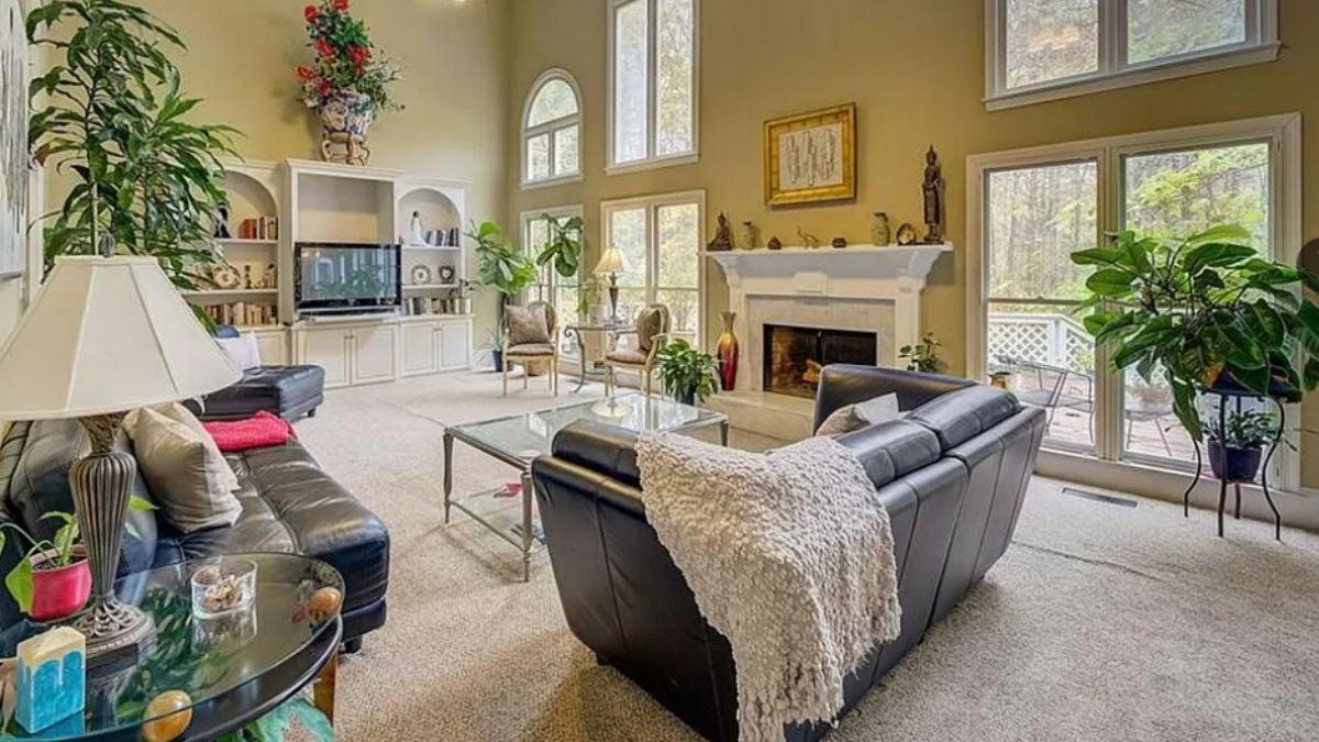 Expansive Living Room with Vaulted Ceilings and a Wall of Windows