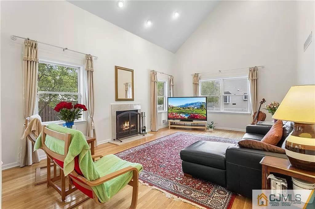 Wow, High Ceilings and a Cozy Fireplace in This Living Room