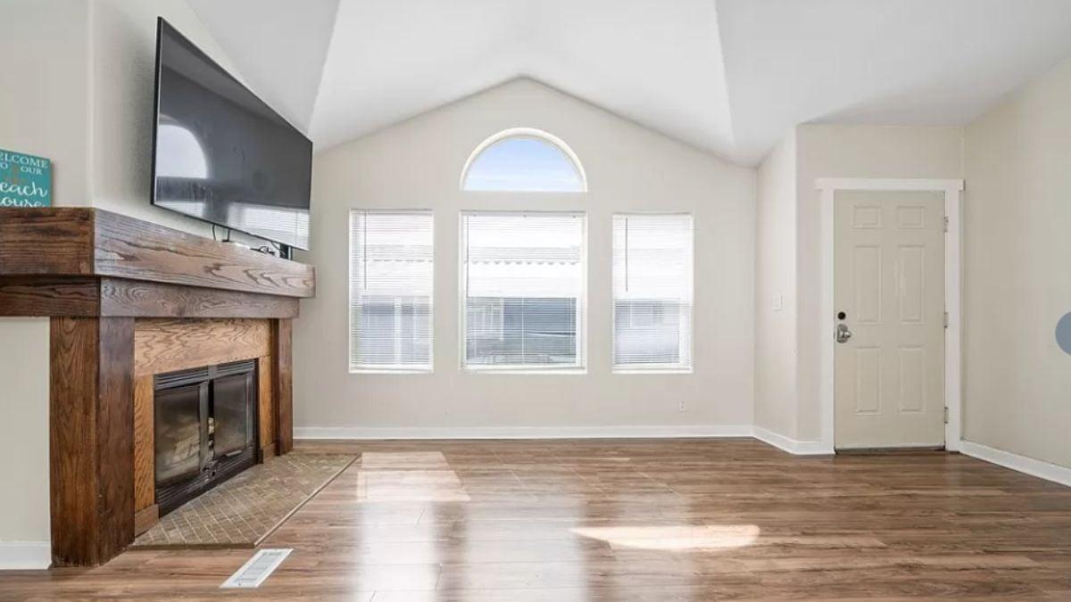 Look at That Vaulted Ceiling with Arched Windows Overlooking the Living Room