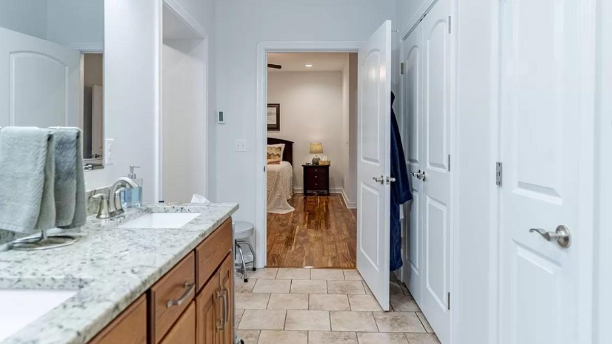 Transitioning from Elegant Bathroom to Cozy Bedroom Hardwood