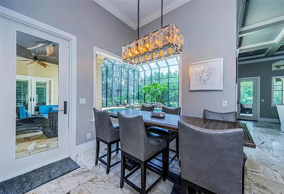 I Love This Sunlit Dining Room with a Striking Rectangular Chandelier