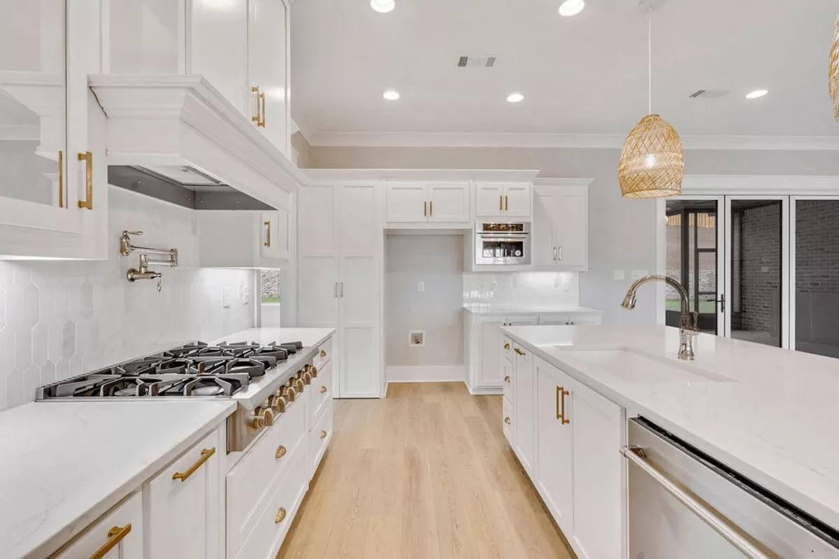Take a Look at the Pot Filler Above This Sleek Cooktop