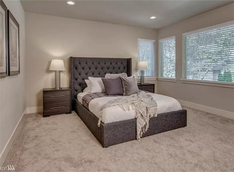 Simple Elegance in a Neutral-Toned Bedroom with Large Windows
