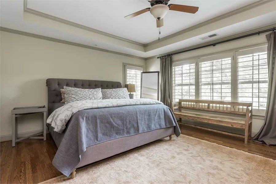 Relax in This Neutral-Toned Craftsman Bedroom With Tray Ceiling