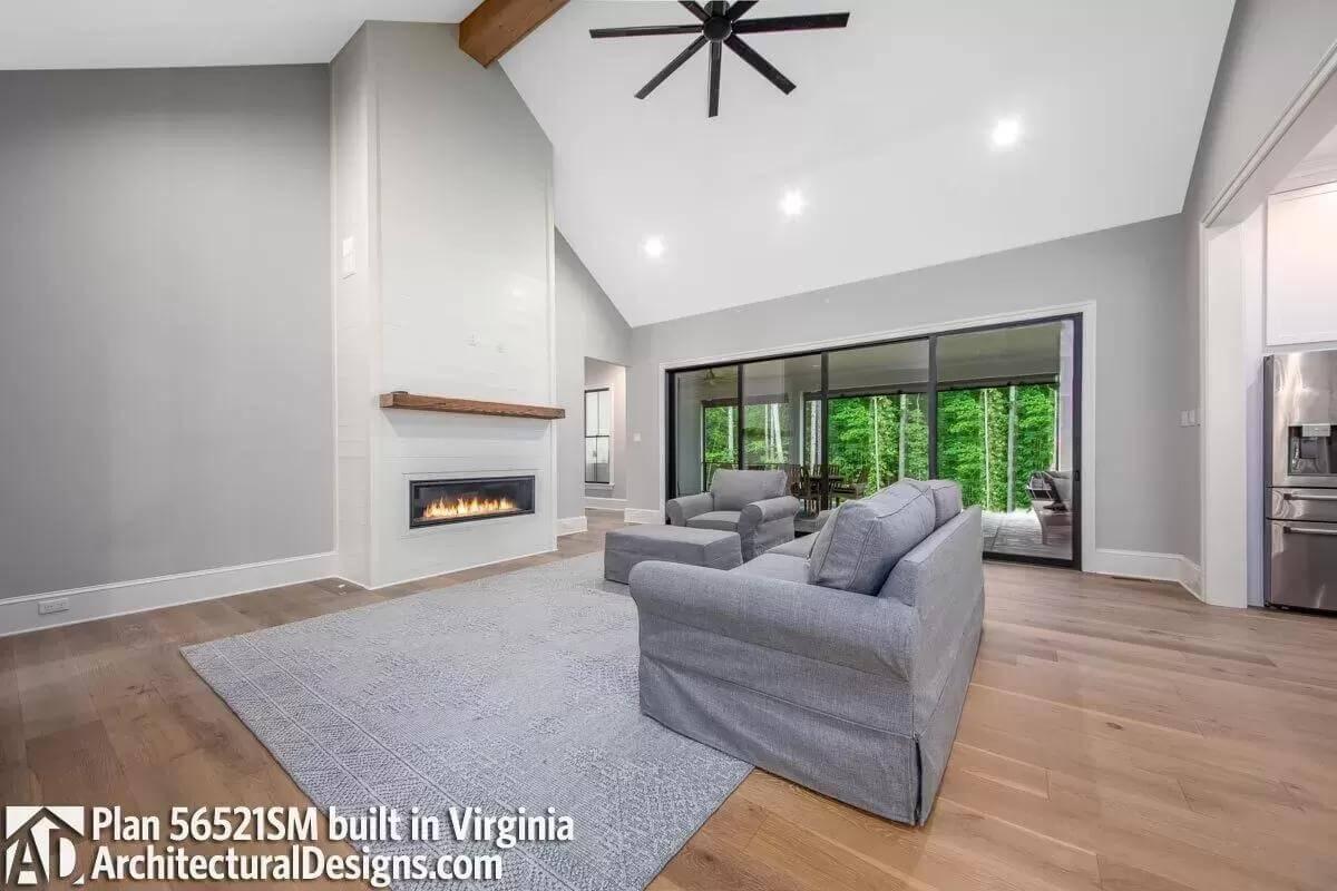 Vaulted Living Space with a Modern Linear Fireplace—Check Out Those Sliding Doors