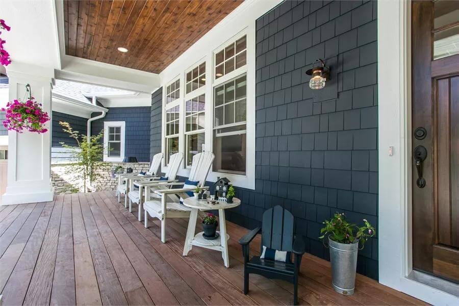 Classic Craftsman Porch with Sleek Dark Siding and Cedar Ceiling