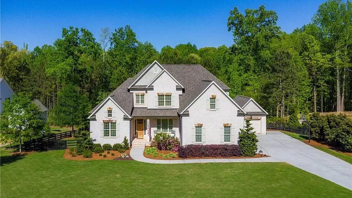 Charming White Brick Exterior with Classic Gable Rooflines