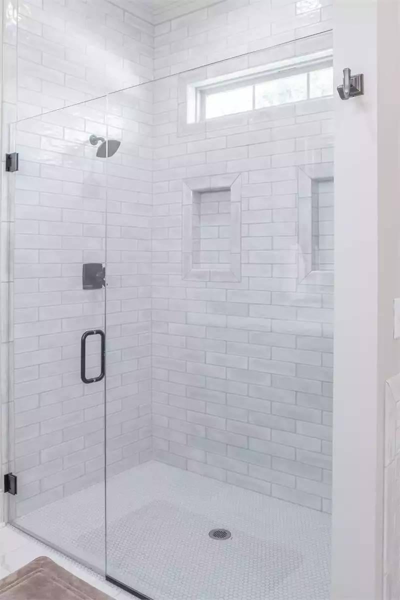 Take a Peek at the Sleek Glass-Enclosed Shower with Subway Tile