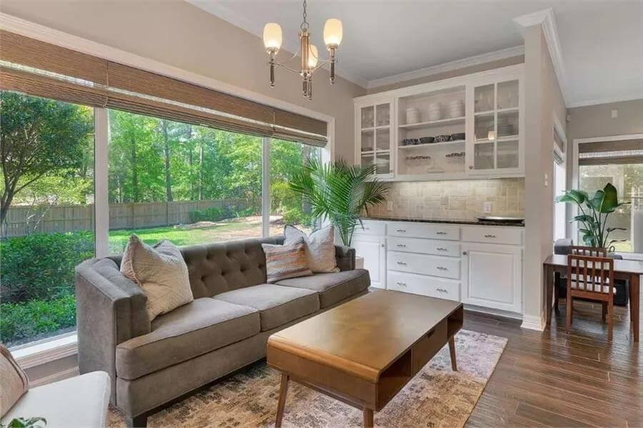 Wow, Notice the Built-In Glass Cabinets in This Bright Sitting Area