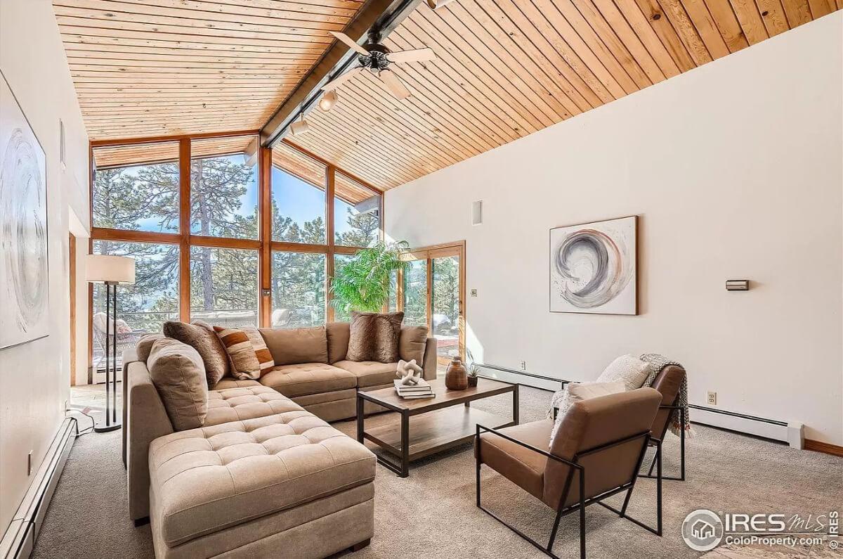 Take in the Vaulted Wood Ceiling in This Sunlit Living Room