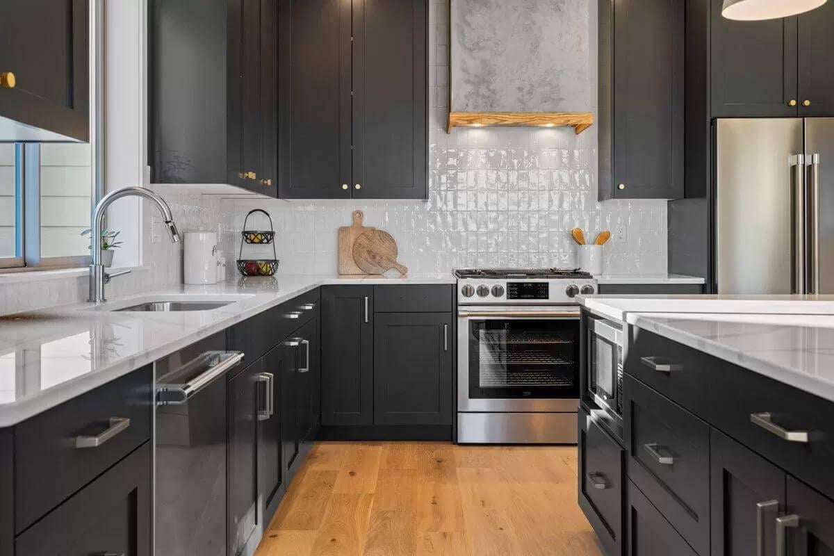 Dial in on Those Matte Black Cabinets with Subtle Brass Highlights