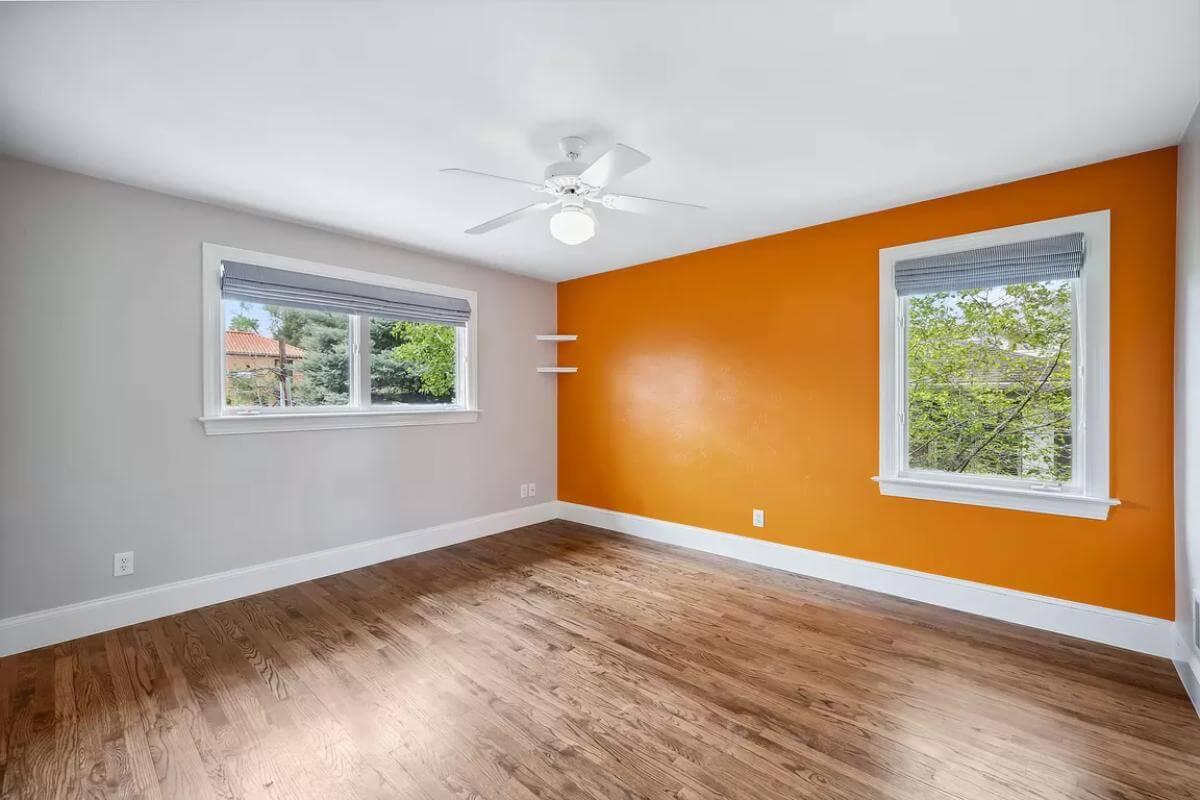 Notice the Bold Accent Wall in This Bright Bedroom