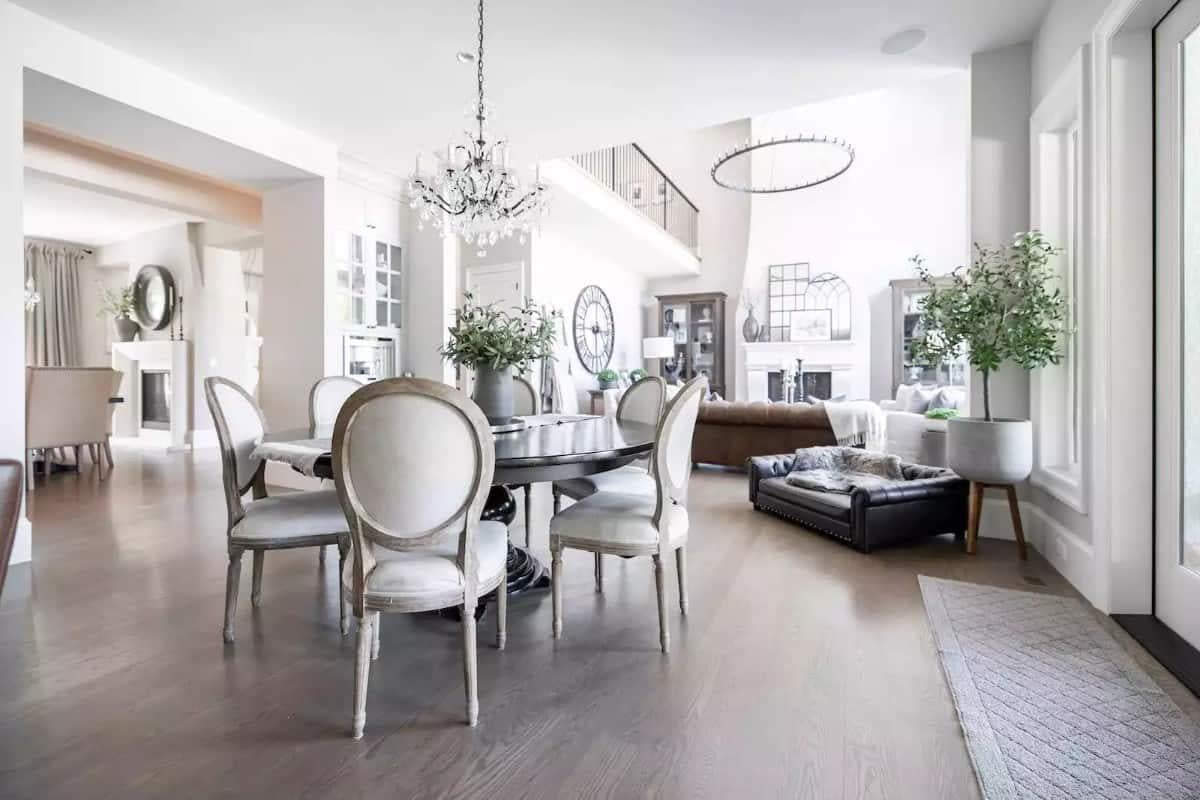 Notice the Crystal Chandelier and Elegant Dining Arrangement