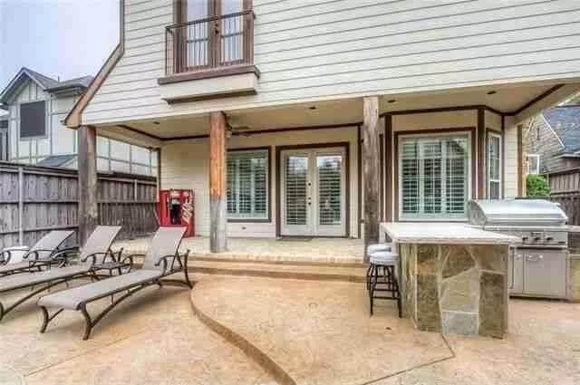 Outdoor Oasis with Stone Grill Station and Relaxing Loungers