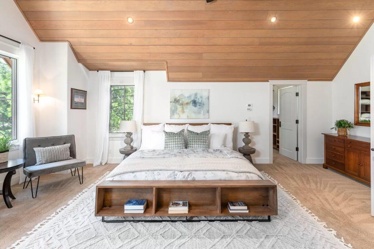 Notice the Wooden Paneling and Built-In Shelves in This Serene Bedroom