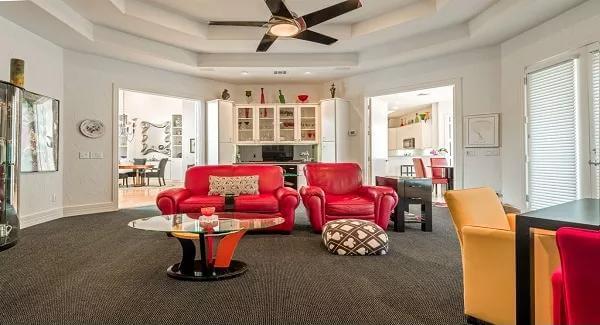 Feel the Energy in This Living Room With Bold Red Seating