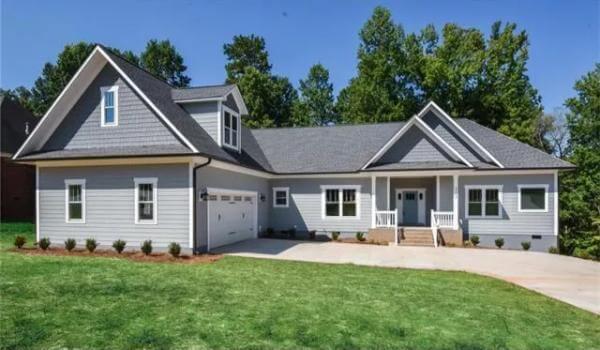 Classic Craftsman Charm with Symmetrical Dormers and a Welcoming Porch