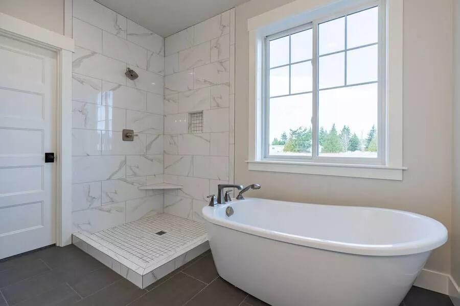 Freestanding Tub Next to the Large Shower in This Craftsman Bathroom