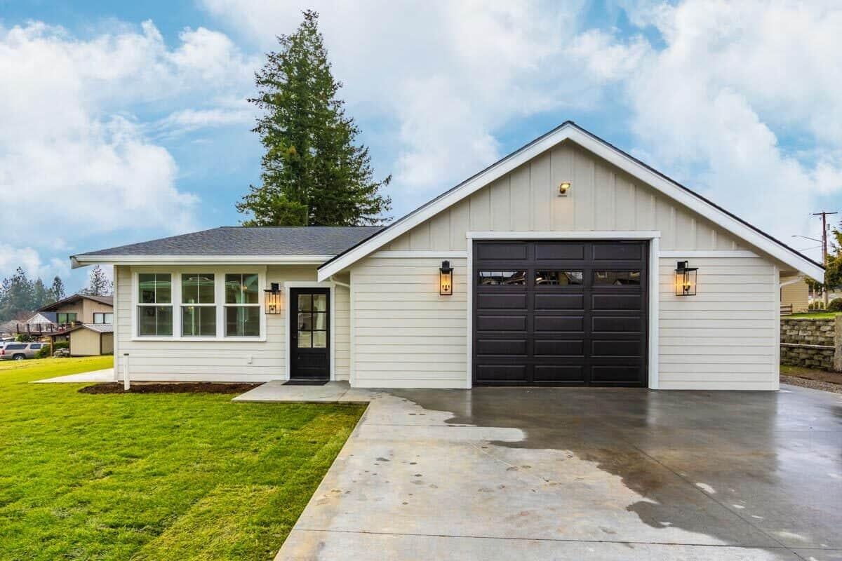 Charming Bungalow with Striking Black Garage Door