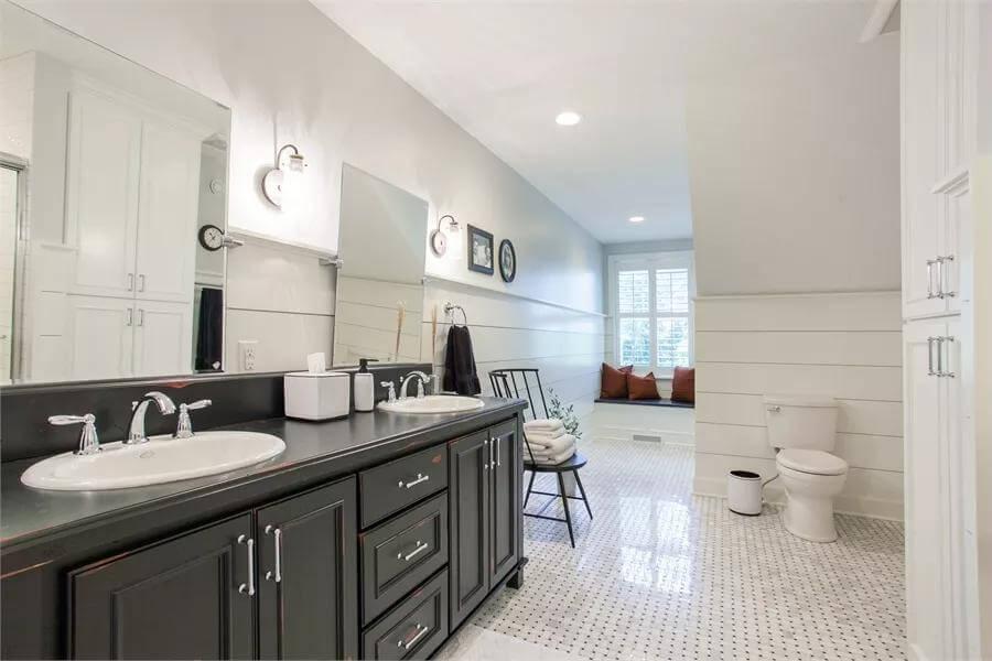 Dual Sink Bathroom with Craftsman Touch in the Built-in Window Seat