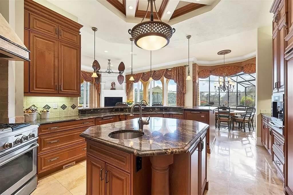 Check Out These Luxurious Mahogany Cabinets in This Spacious Kitchen
