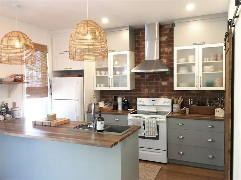 Rattan Pendants and Brick Backsplash Give This Kitchen a Rustic Touch