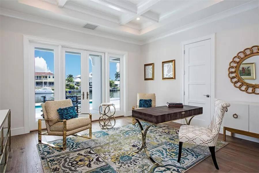 Home Office with Waterfront Views and Patterned Rug Detail