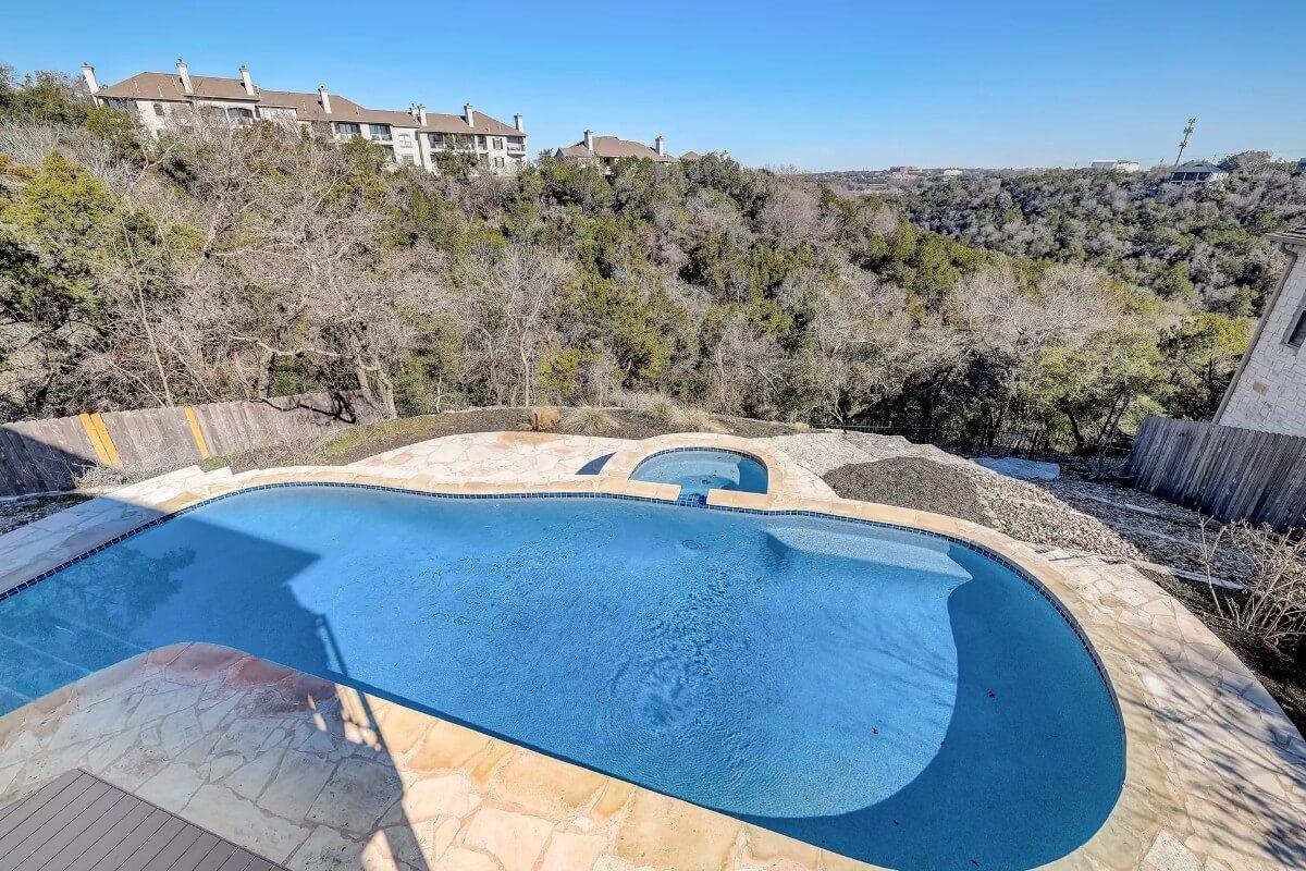 Enjoy the Scenic Poolside Views from This Beach-Style Pool
