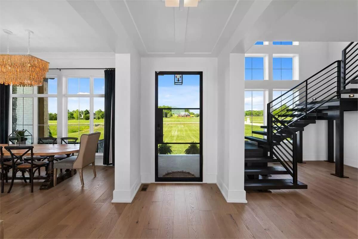 Notice the Modern Floating Staircase in This Open-Concept Entryway