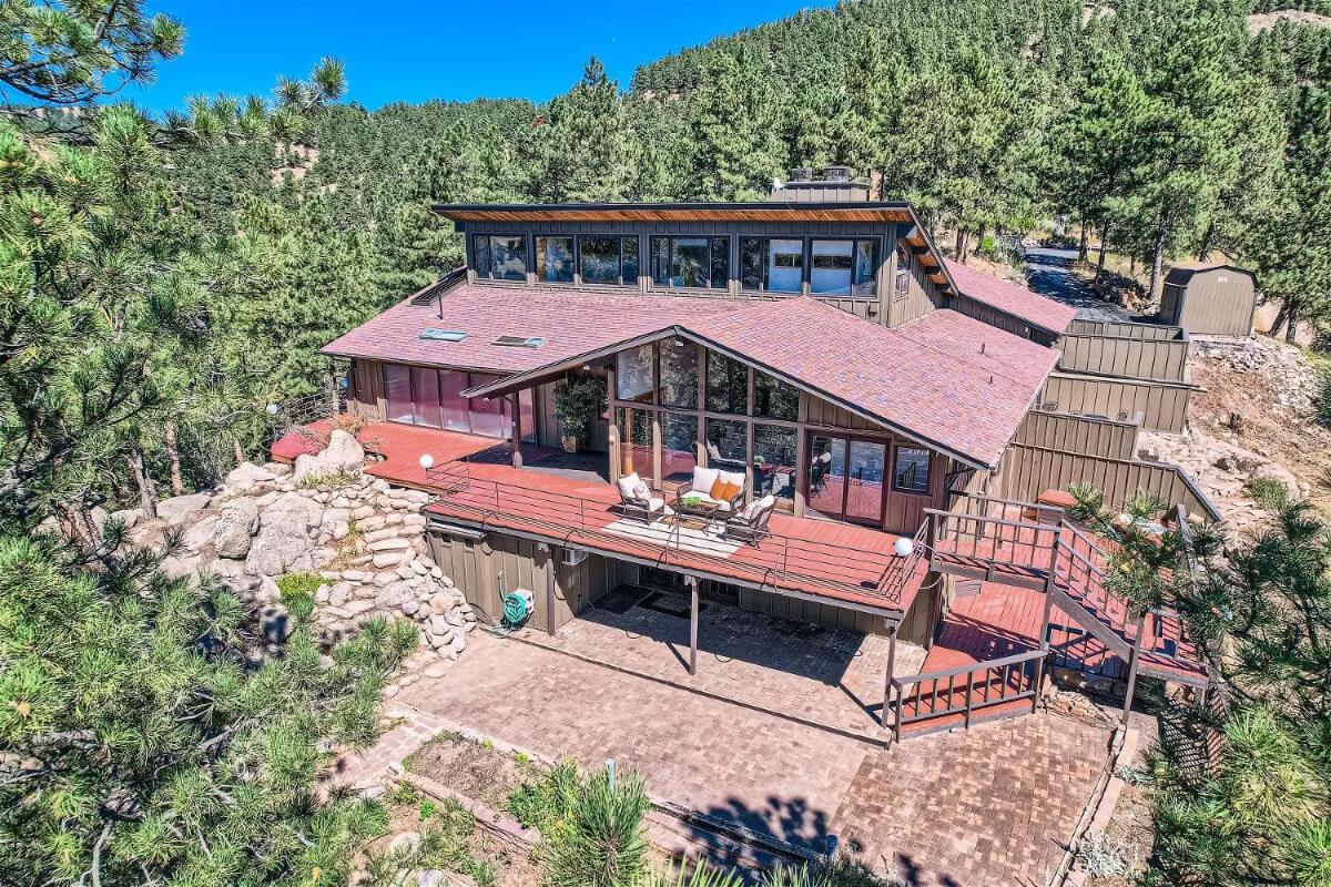 Admire the Expansive Loft Windows of This Mountain Retreat