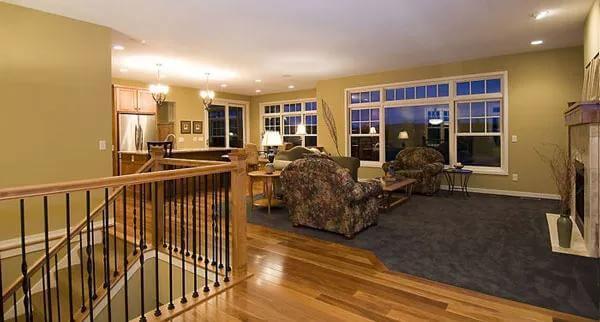 Spacious Living Area with Warm Wood Floors and Open Flow to the Kitchen