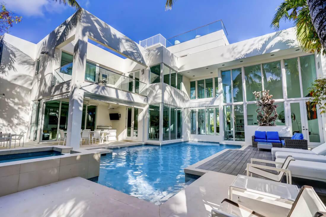 Wow, Notice the Two-Story Glass Walls Surrounding This Modern Pool Area