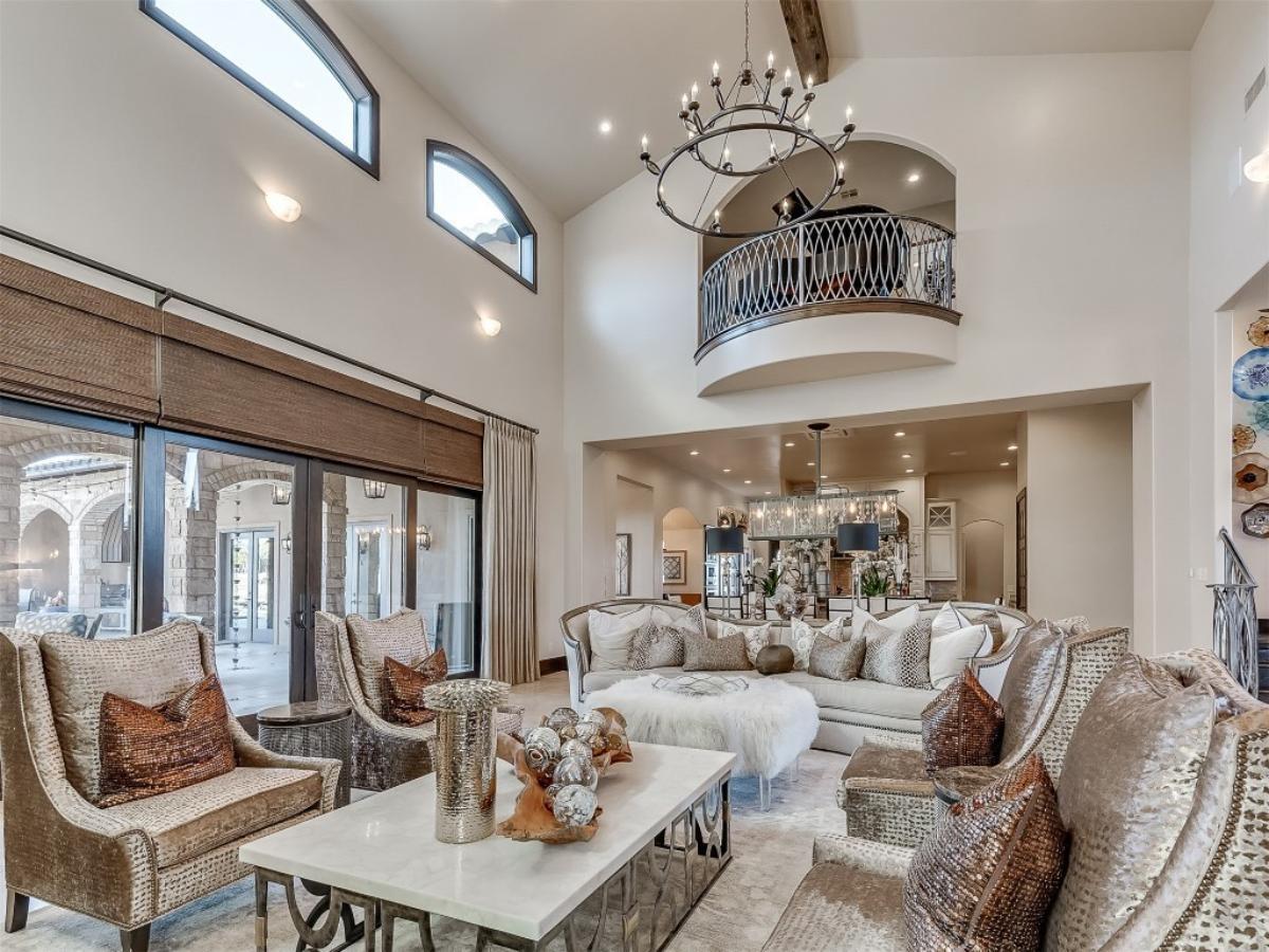 Marvel at the Double-Height Living Room with an Elegant Curved Balcony
