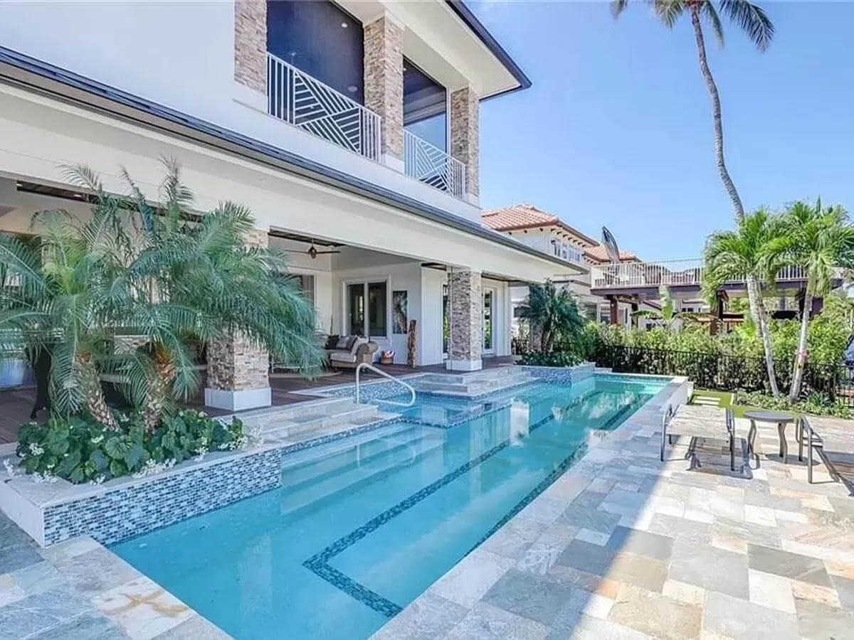 Look at the Sleek Stone Columns Framing This Luxury Pool Area