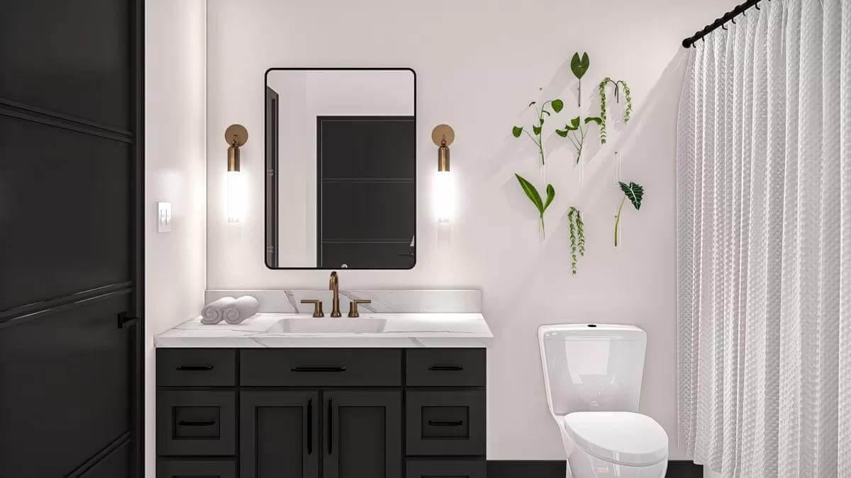 Sleek Bathroom Vanity with Brass Fixtures and a Touch of Green