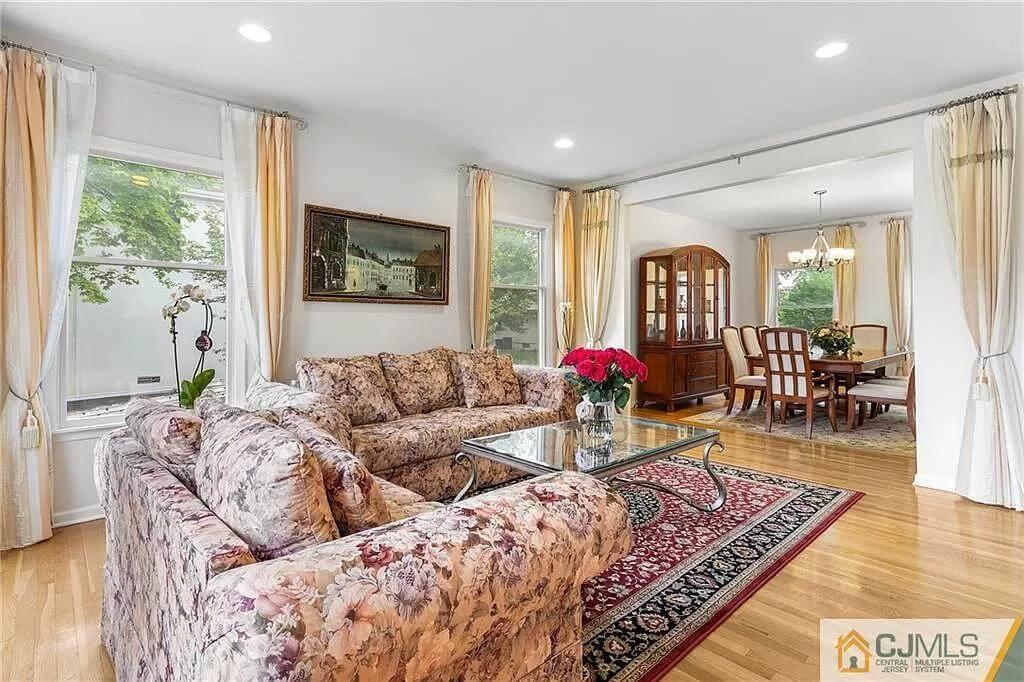 Florals and Open Spaces: A Living Room That Flows Into Formal Dining