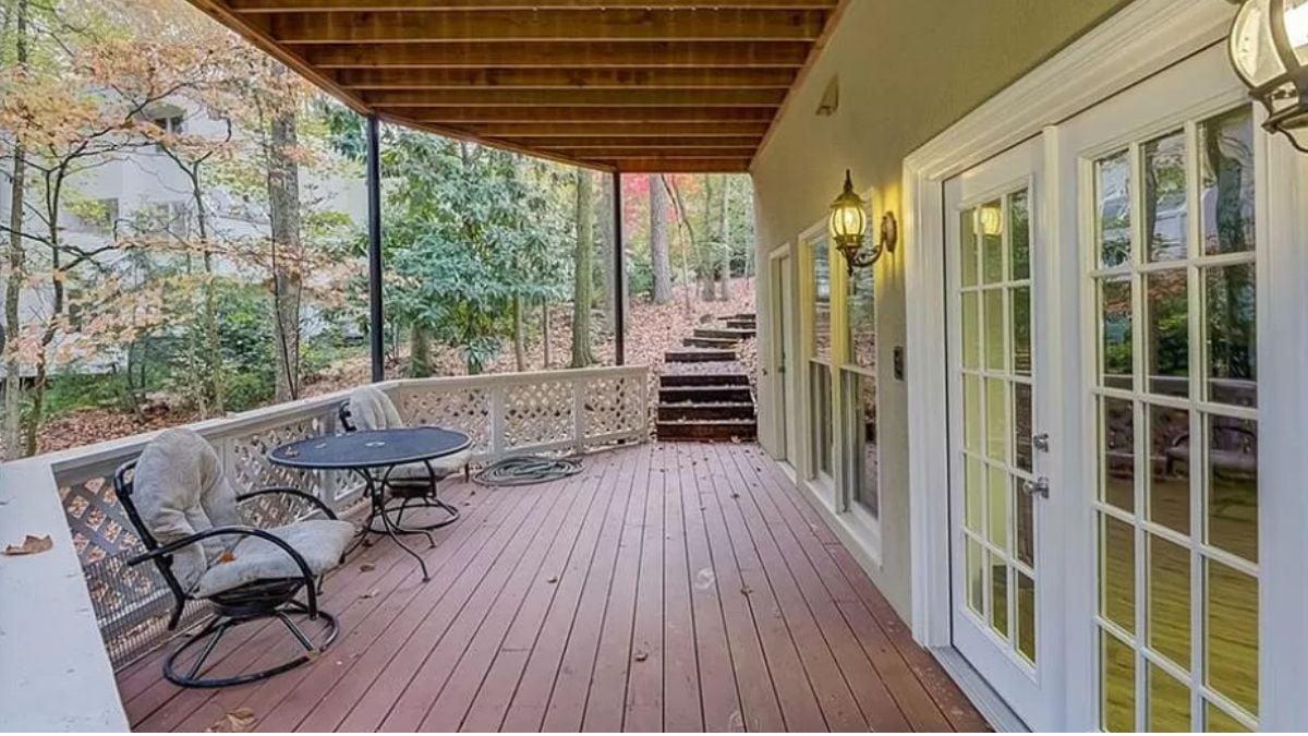 Charming Porch with Freestanding Railings and a View into the Woods