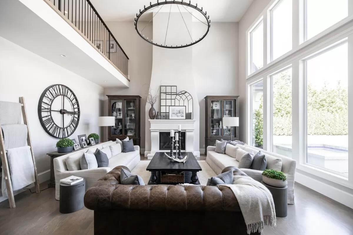 Vaulted Living Room with a Striking Clock and Light-Filled Ambiance