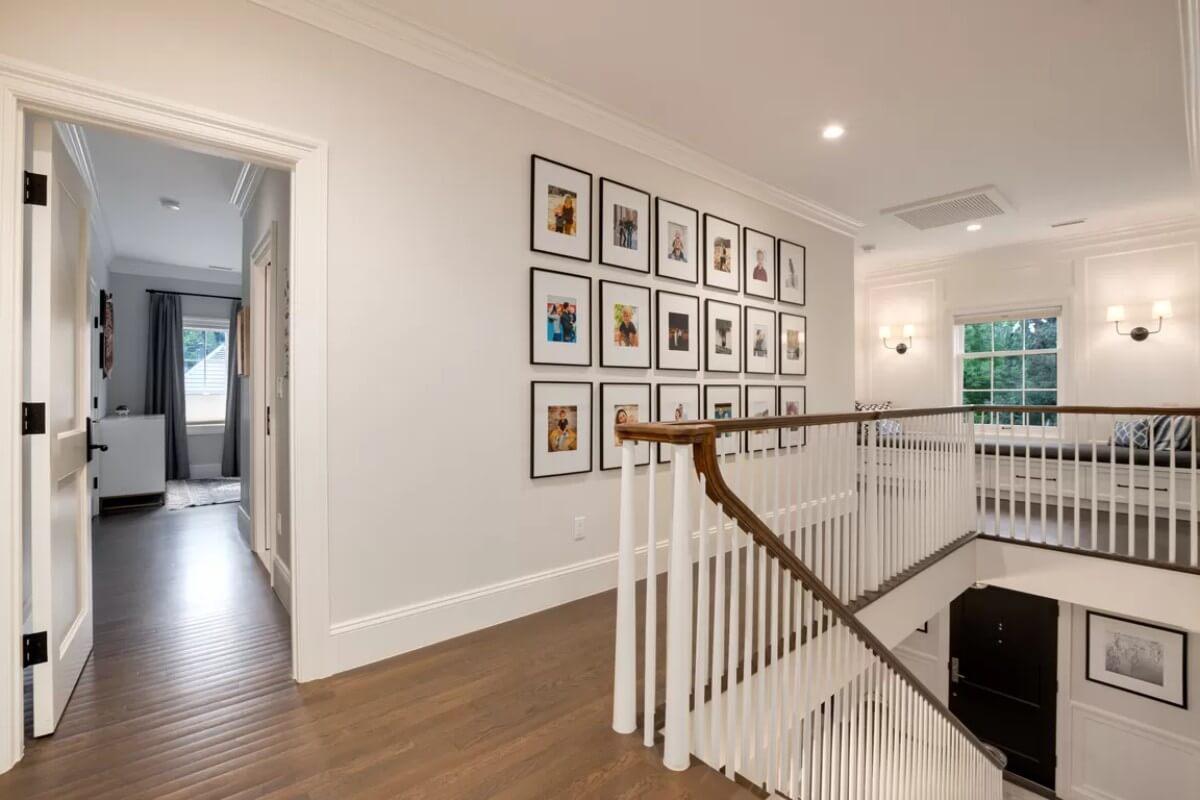 Explore This Inviting Gallery Wall and Cozy Window Seat Along the Upper Landing