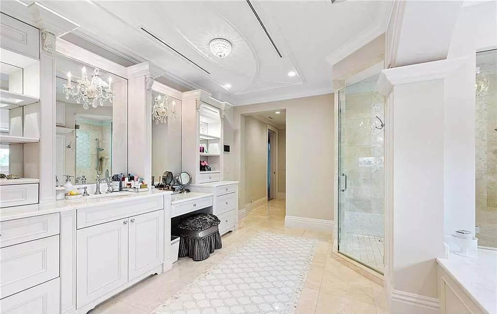 Elegant Bathroom Vanity Setup With Crystal Chandeliers
