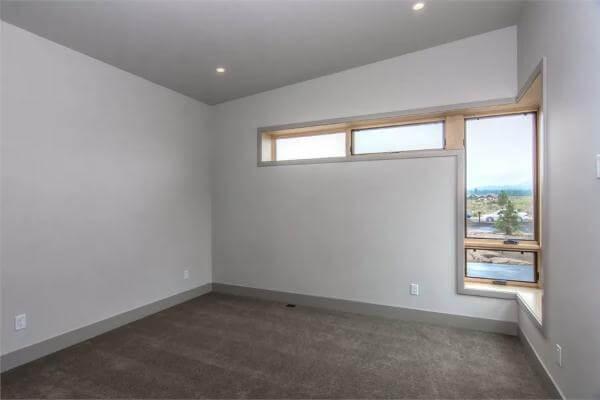 Minimalist Bedroom with Horizontal Windows That Frame the View