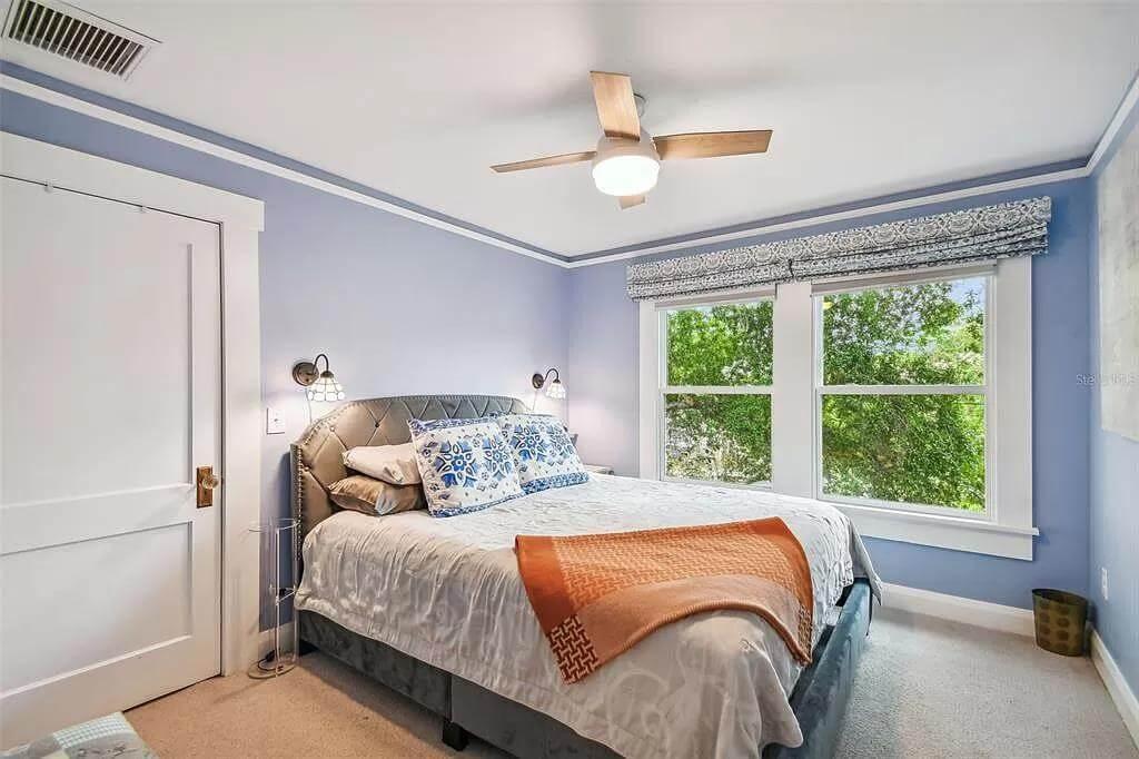 Cozy Craftsman Bedroom with Nature Views and Ceiling Fan