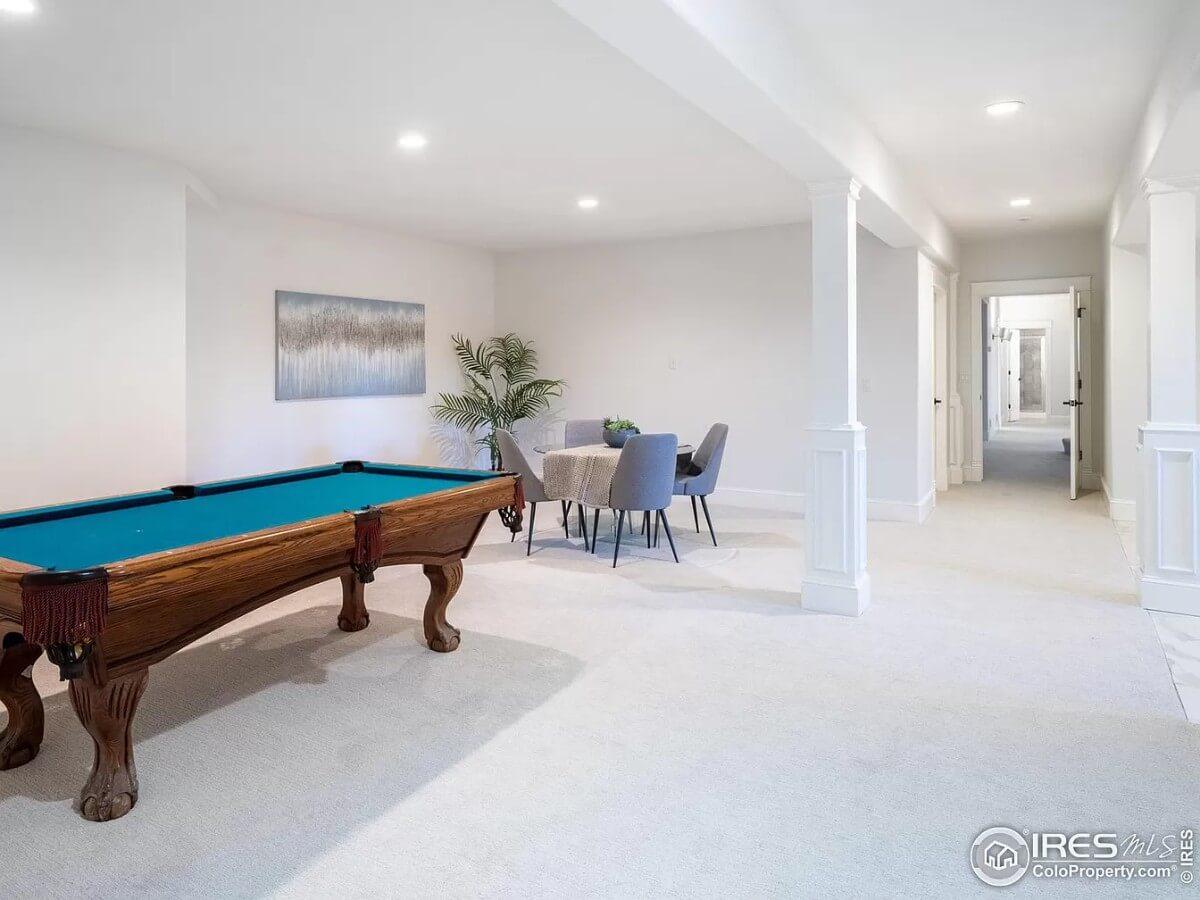Notice the Elegant Pool Table in This Spacious Recreation Room
