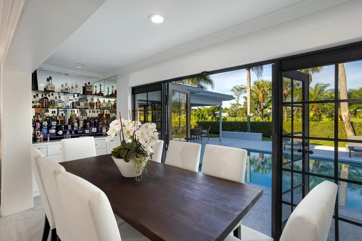 Stylish Indoor-Outdoor Dining Experience with Poolside Views