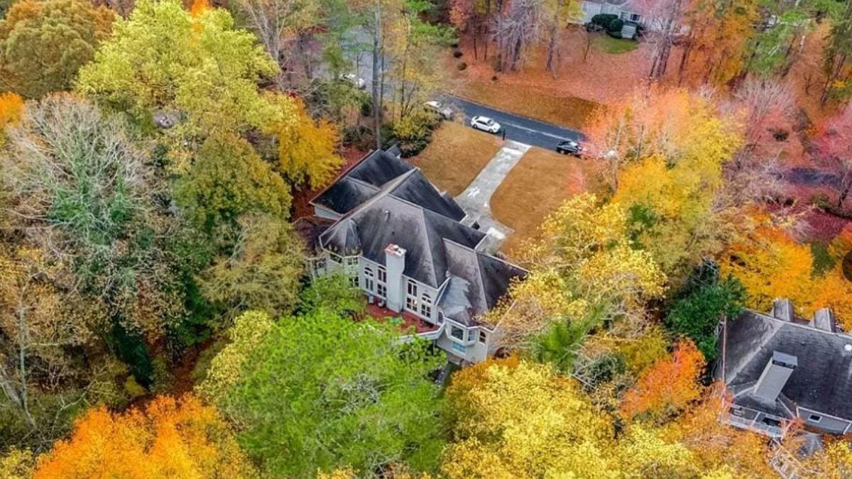 Stunning Aerial View of the Estate Nestled in Vibrant Fall Foliage
