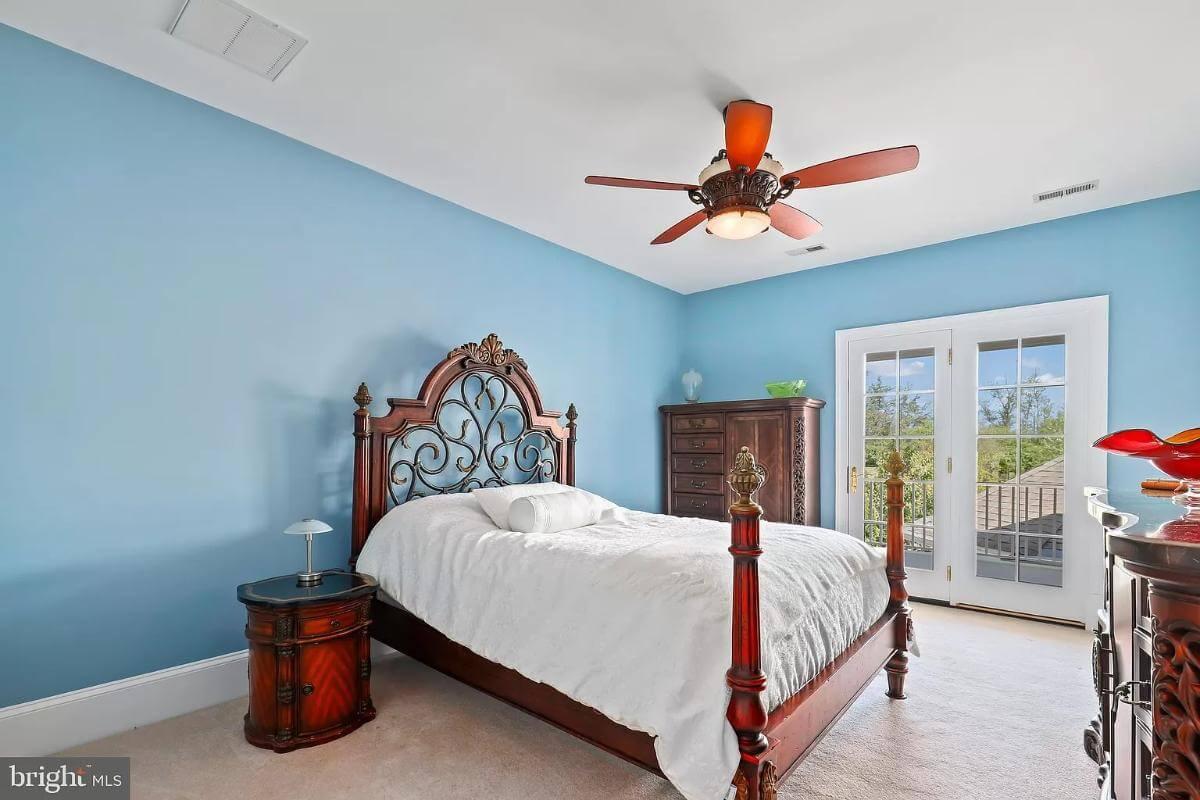 Classic Bedroom with French Doors and Intricate Woodwork