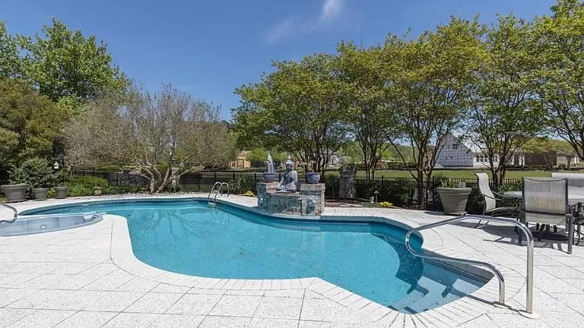 Poolside Bliss with a Serene Water Feature at Its Center